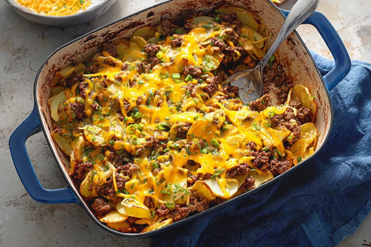 Campfire Beef and Potato Casserole baked golden with melted cheese and ground beef.